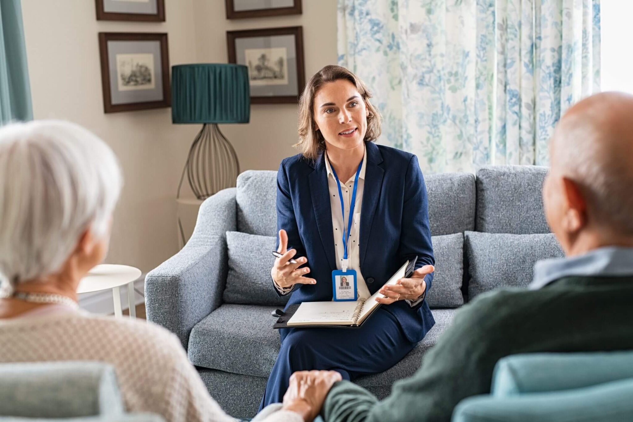 A professional therapist consulting with clients in a cozy room.